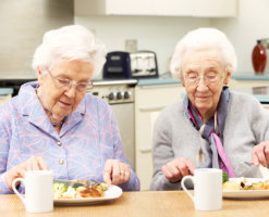 Elderly women having breakfast