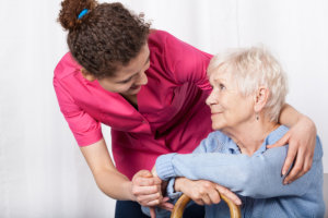 Elder woman and female staff